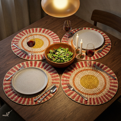 Étoile Flamboyante - Round placemat in handwoven seagrass, sun pattern – lifestyle view – Handcrafted product, handmade · Kuênia