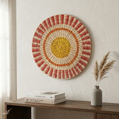 Étoile Flamboyante - Round placemat in handwoven seagrass, sun pattern – in-use view – Handcrafted product, handmade · Kuênia